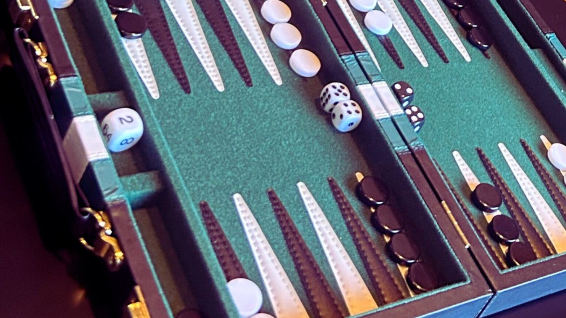 ROHO SLIDE TV An open backgammon board with dice
