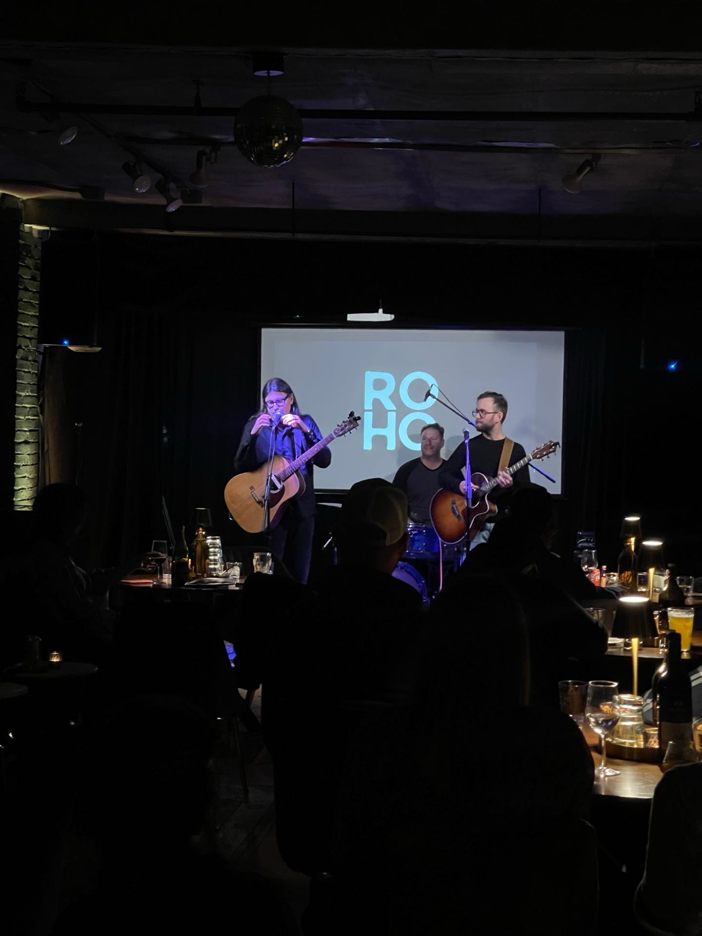 Acoustic trio performing on the ROHO stage